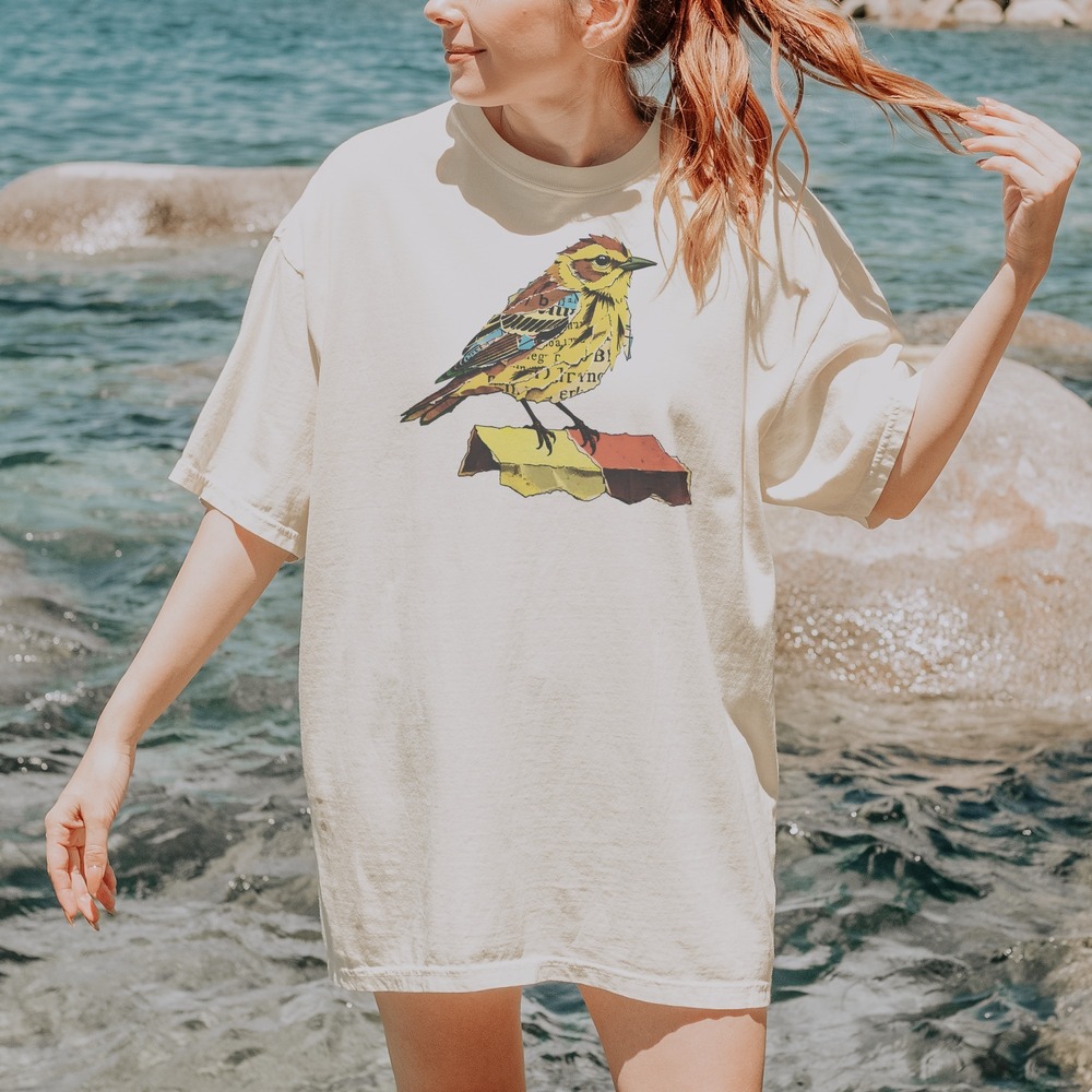Songbird Perched on Torn Newspaper Scraps Tee